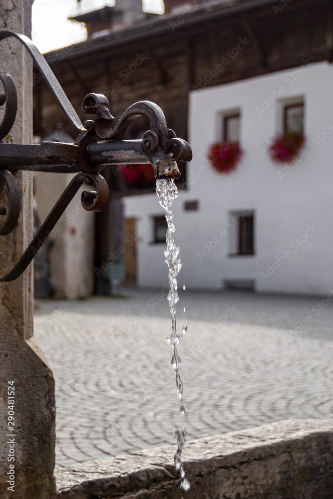 rusty metal fountain from which water flows in slow motion rusty metal fountain from which water flows in slow motion