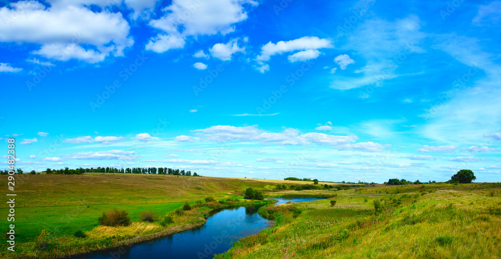 Beautiful panoramic landscape with river and fields