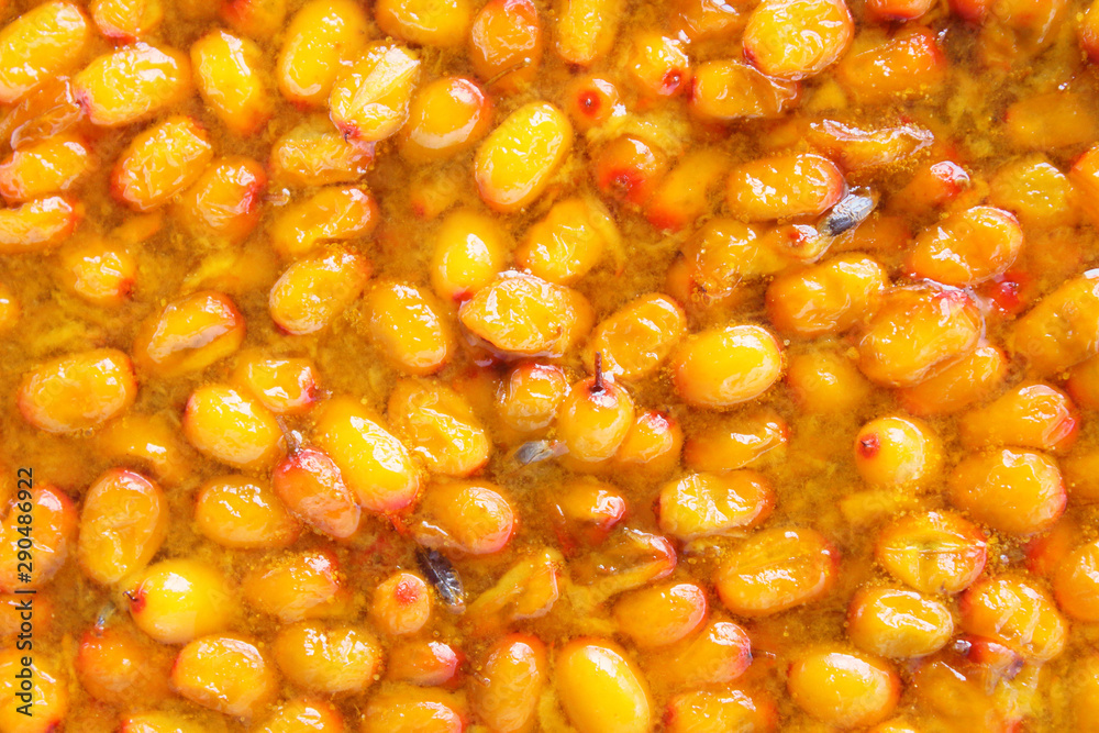 Fresh sea buckthorn jam. Close-up. Top view. Background. Texture. Fresh sea buckthorn jam. Close-up. Top view. Background. Texture.