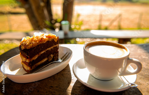 Hot coffee, cake and strawberry with cream on the breakfast table in morning