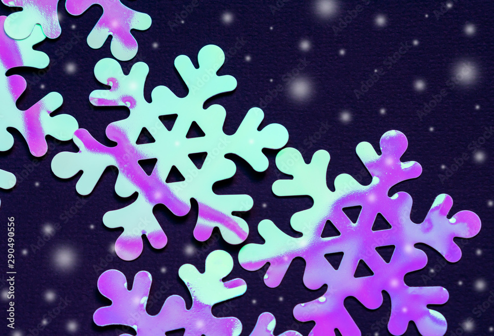 Trending neon snowflakes on dark background. Christmas pattern. 3D holographic effect. Winter concept. Cold, ice Trending neon snowflakes on dark background. Christmas pattern. 3D holographic effect. Winter concept. Cold, ice