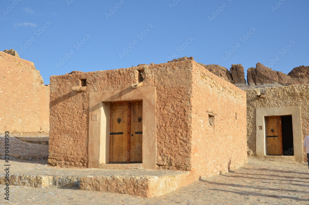 Small stone buildings in the dessert oasis of Chebika