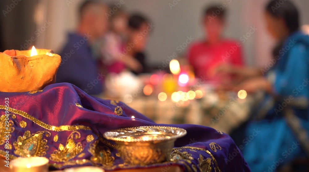 Diwali is the festival of lights. Hindus family celebrate at home. Hinduism holiday. Lighting