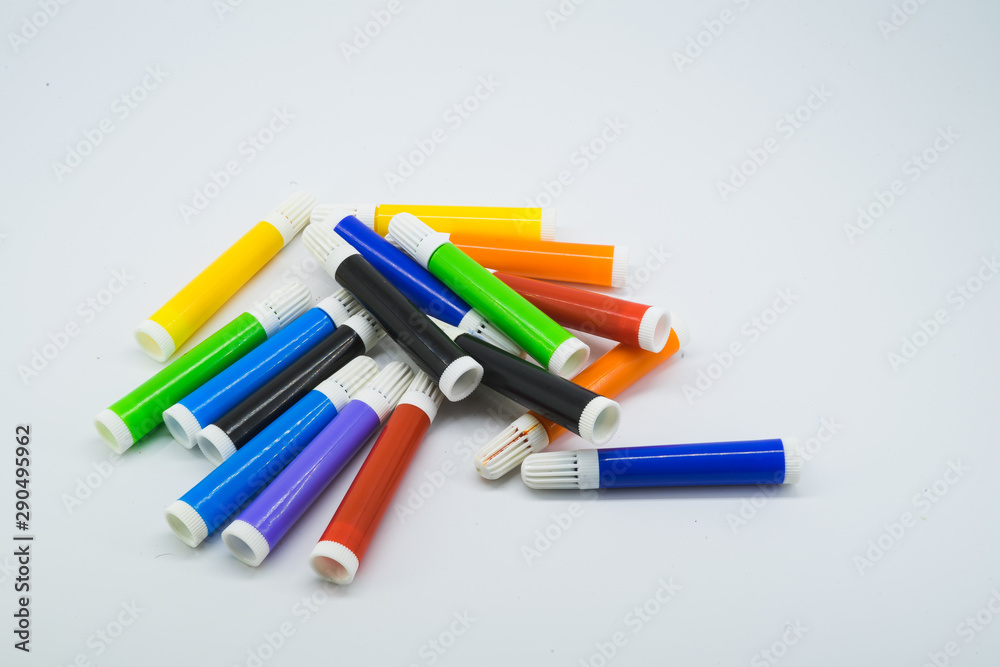 Colourful school supplies, markers stationery on white background - space for caption Colourful school supplies, markers stationery on white background - space for caption