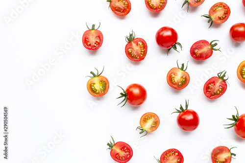 Fresh tomatoes, whole and half cut isolated on white background.