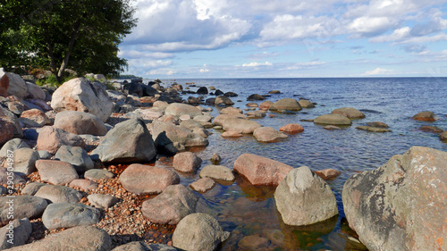 View on the great erratic boulders and stone fields on the coast near Käsmu on the Baltic sea in Estonia. Käsmu is located on the on a peninsula and is part of the Lahemaa National Park.