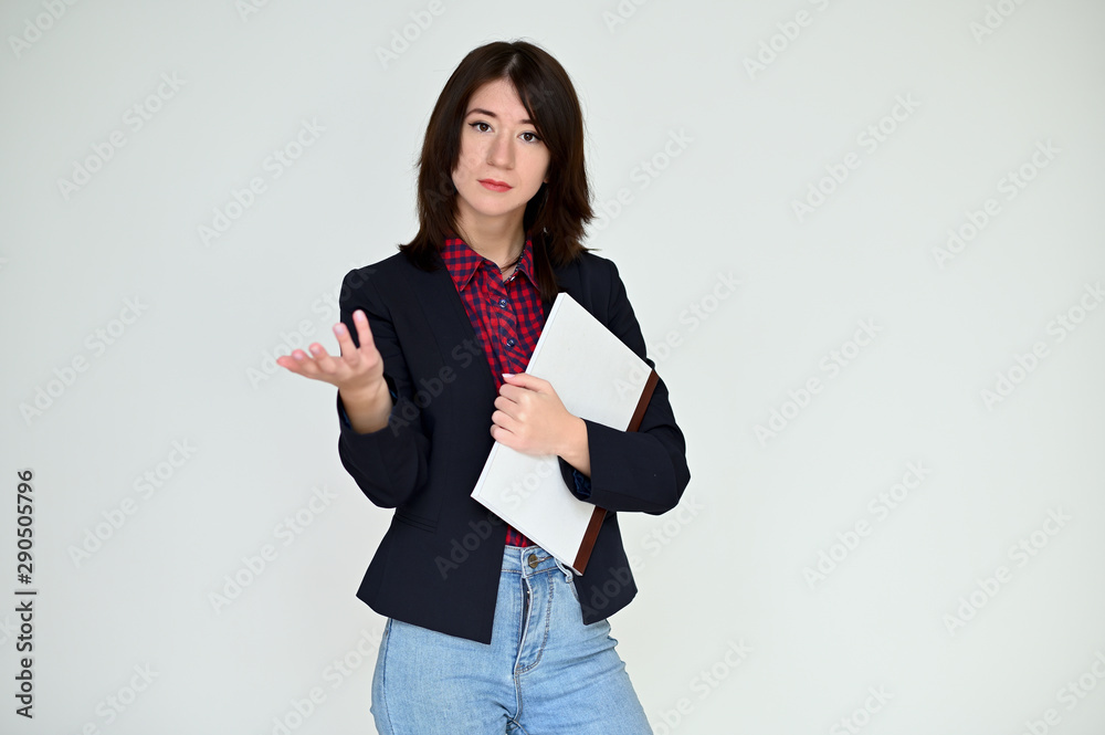 Portrait of a pretty asian brunette girl with black hair in a dark jacket and blue jeans on a white background. It stands right in front of the camera, with emotions in various poses. Portrait of a pretty asian brunette girl with black hair in a dark jacket and blue jeans on a white background. It stands right in front of the camera, with emotions in various poses.