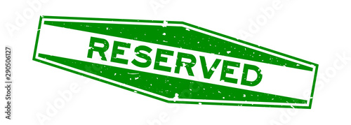 Grunge green reserved word hexagon rubber seal stamp on white background
