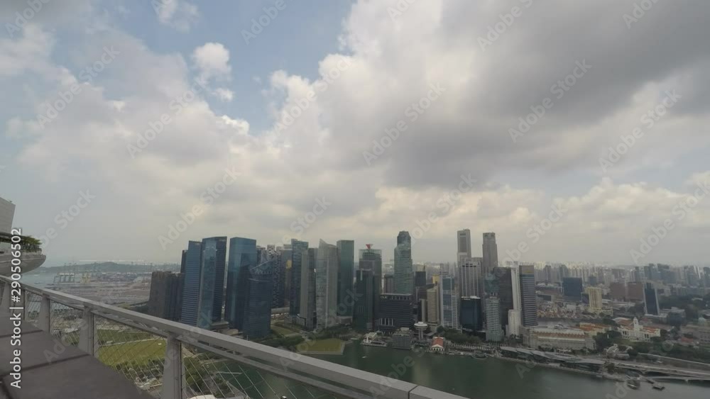 Fast time lapse of clouds passing and forming over skyscrapers at Singapore skyline Fast time lapse of clouds passing and forming over skyscrapers at Singapore skyline
