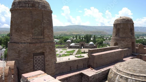 Hisor Fortress High Angle View of the Main Square Watchtowers and Madrasa Caravanserai on a Sunny Blue Sky Day photo