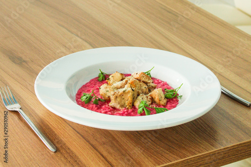 risotto chicken meat (red rice with beetroot flavor) menu concept. food background. copy space. Top view