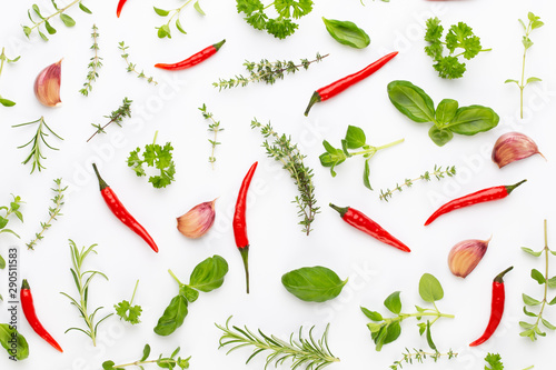 Spice herbal leaves and chili pepper on white background. Vegetables pattern. Floral and vegetables on white background. Top view, flat lay.