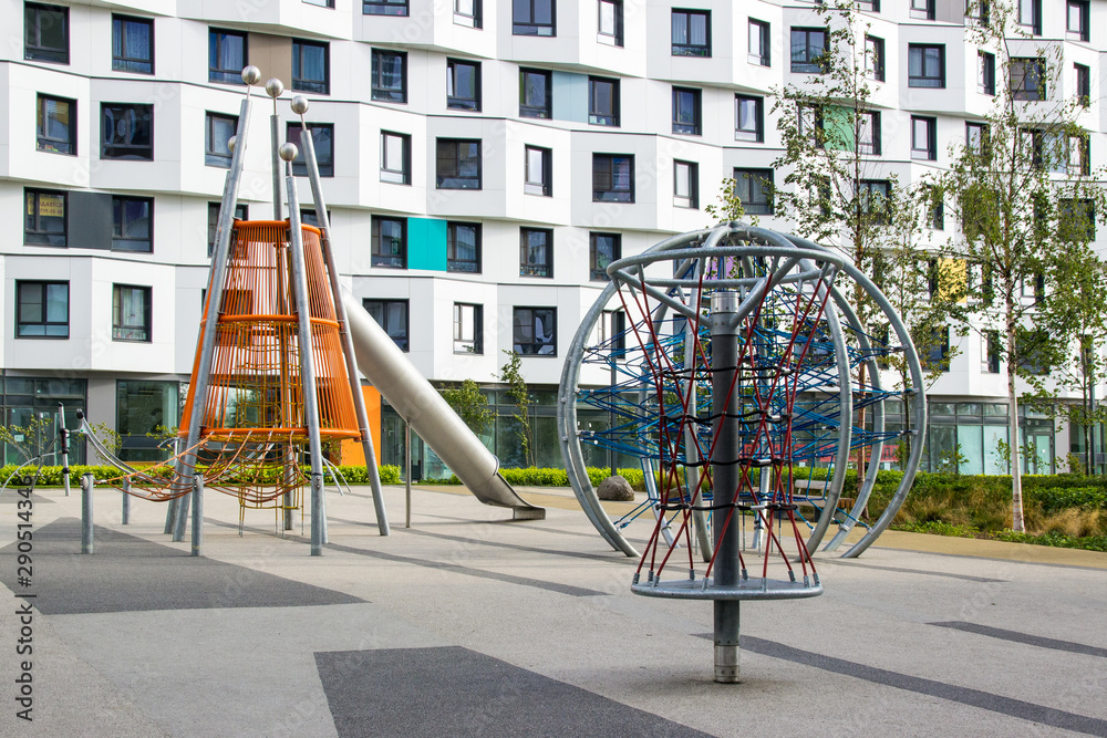 Modern playground with a piece of rope equipment inscribed in the landscape design. Climbing net at the park playground