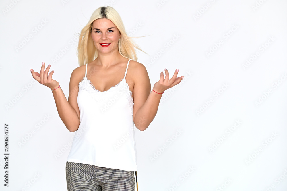 Portrait of a cute caucasian blonde girl with blond hair in a white t-shirt and pants on a white background. It stands right in front of the camera, with emotions in various poses. Portrait of a cute caucasian blonde girl with blond hair in a white t-shirt and pants on a white background. It stands right in front of the camera, with emotions in various poses.