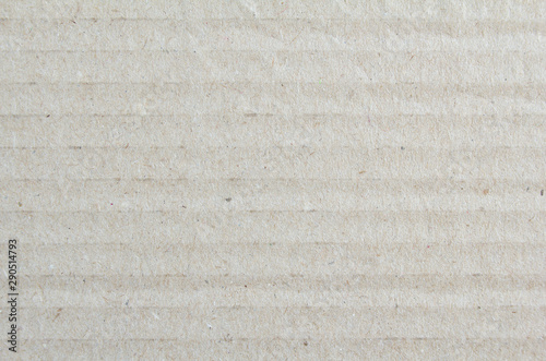 Closeup sheet of grey dirty goffered cardboard paper texture background. photo