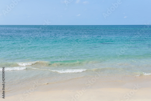 Beautiful sand beach and tropical sea at sunny summer day. Travel vacation relax concept.