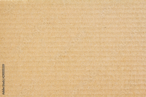 Brown sheet of craft goffered cardboard paper texture background. photo