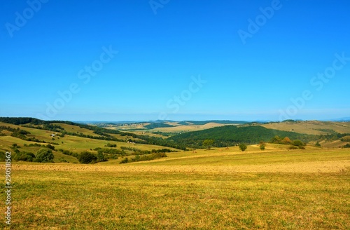 a village between the hills of Transylvania seen from above