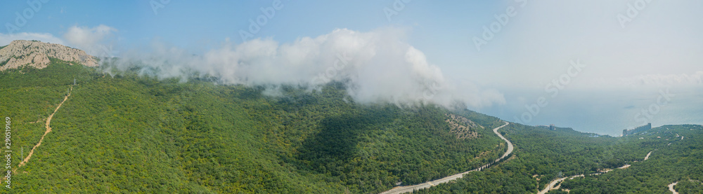 Crimea travel: high resolution panoramic view of seaside resort city, mountains and hills