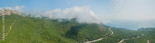 Crimea travel: high resolution panoramic view of seaside resort city, mountains and hills