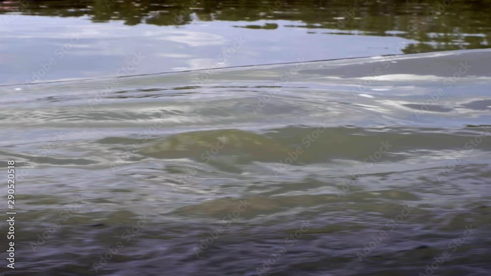 reflections on the surface of the water stirred by a ship reflections on the surface of the water stirred by a ship