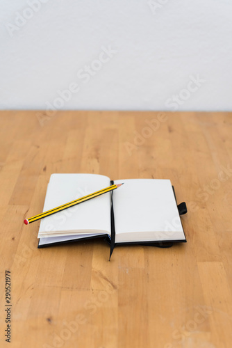 white paper of a notebook with a pencil