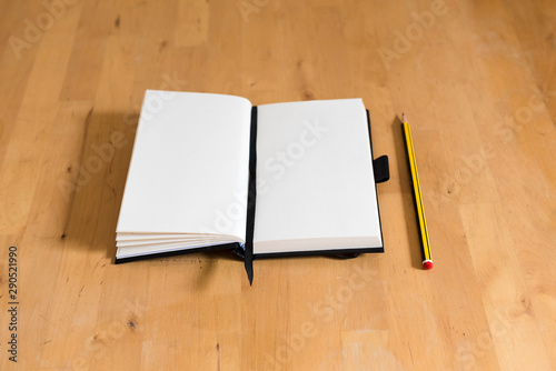 white paper of a notebook with a pencil