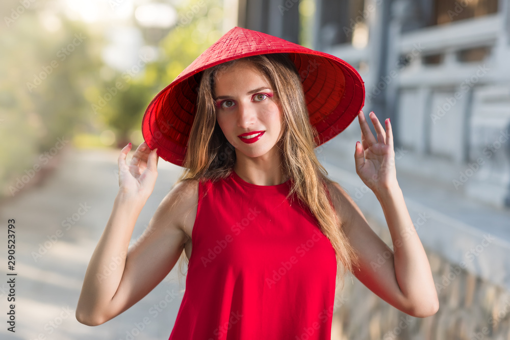 Fashion portrait of a beautiful woman in red hat