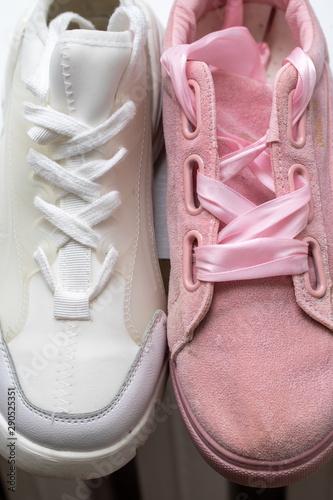 White and pink sports shoes for girls, fashion.