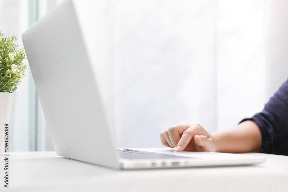 Young women working on her laptop in office. Young women working on her laptop in office.