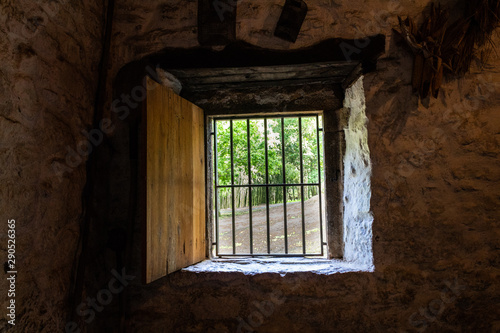 old windows in a rural house with bars