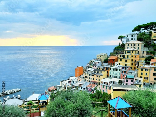 Liguria, Italy - 09/15/2019: Travelling around the ligurian seaside in summer days with beautiful view to the famous places. An amazing caption of the water and the sky reflection with blue sky. photo