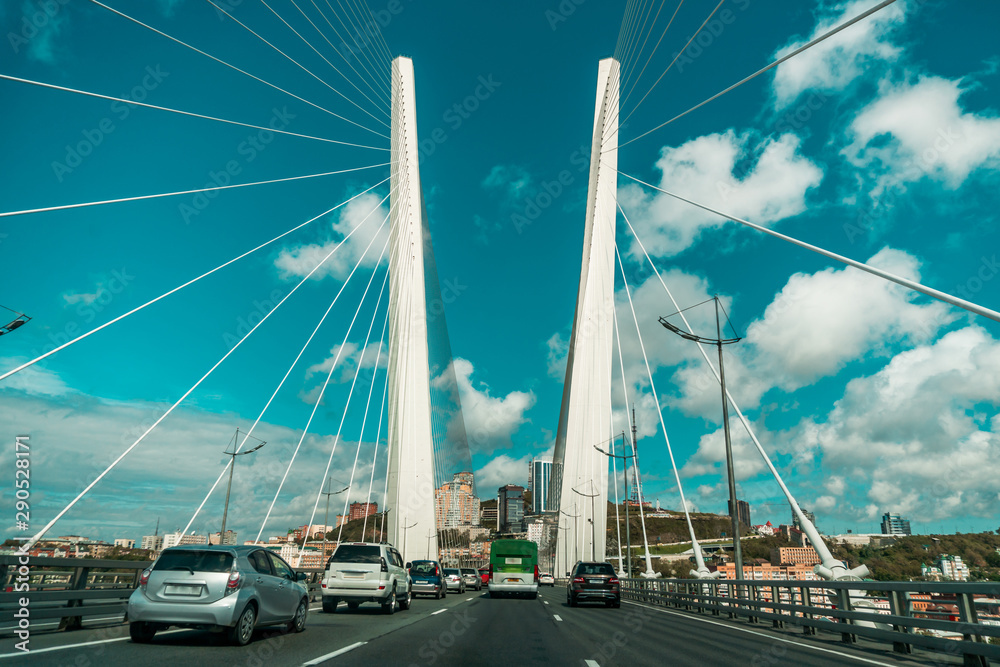 Fototapeta premium Tall white curtain car bridge with road