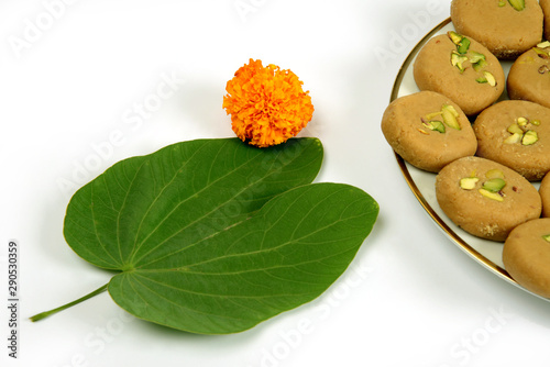 Apta leaf and marigold flowers with sweet food, Dussehra or Dasara an Indian religious festival