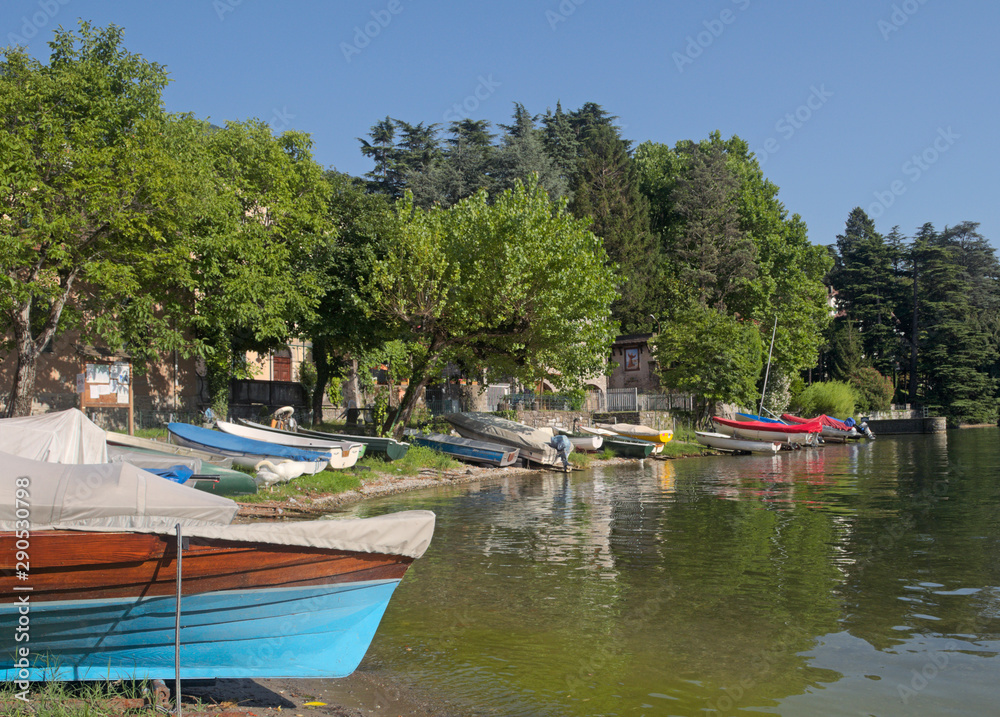 boats on the shore of Lake Como in Lierna, Italy