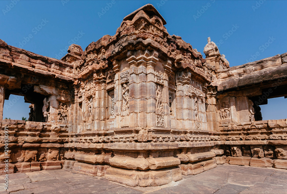 Stone reliefs on walls of the Hindu temple in India. Architecture of 7th century with carved walls in Pattadakal, Karnataka