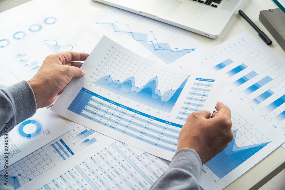 businessman working data document graph chart report marketing research development planning management strategy analysis financial accounting. Business office concept. businessman working data document graph chart report marketing research development planning management strategy analysis financial accounting. Business office concept.