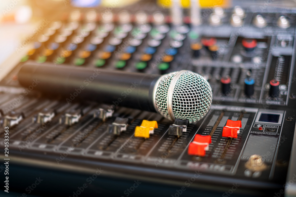 Microphone and audio sound mixer analog at the sound control room