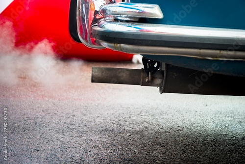 combustion fumes coming out of car exhaust pipe © gargantiopa