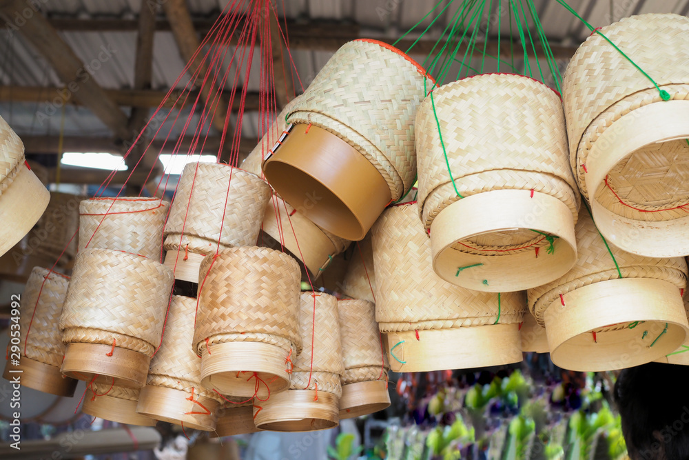 Thai traditional rice box It is called Kratib wicker container made of bamboo, for packing sticky rice. Thai traditional rice box It is called Kratib wicker container made of bamboo, for packing sticky rice.