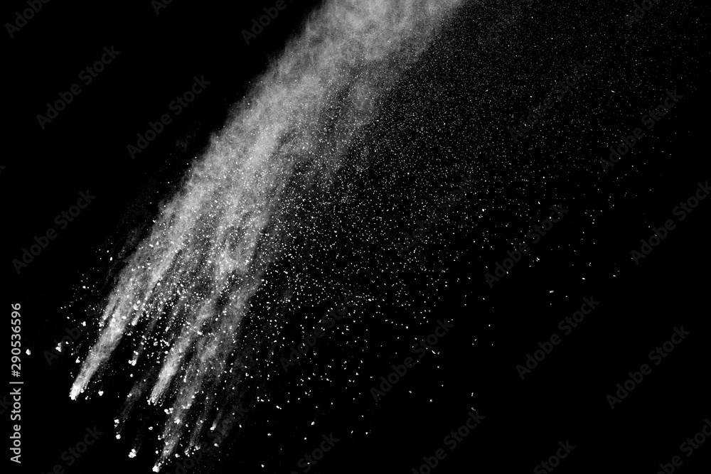 Freeze motion of white color powder exploding on dark background. Freeze motion of white color powder exploding on dark background.