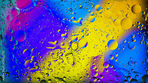 Colorful artistic image of oil drop on water for modern and creation design background.