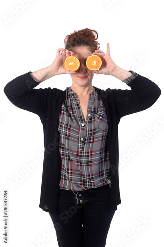 woman with orange fruit on white background