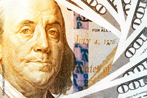 Wallpaper Mural Benjamin Franklin face on US dollar banknote.US dollar is main and popular currency of exchange in the world.Investment and saving concept. Torontodigital.ca