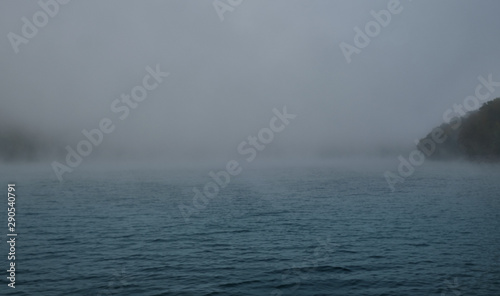 Autumn lake in Kamchatka is covered with fog. Lake Kamchatka autumn
