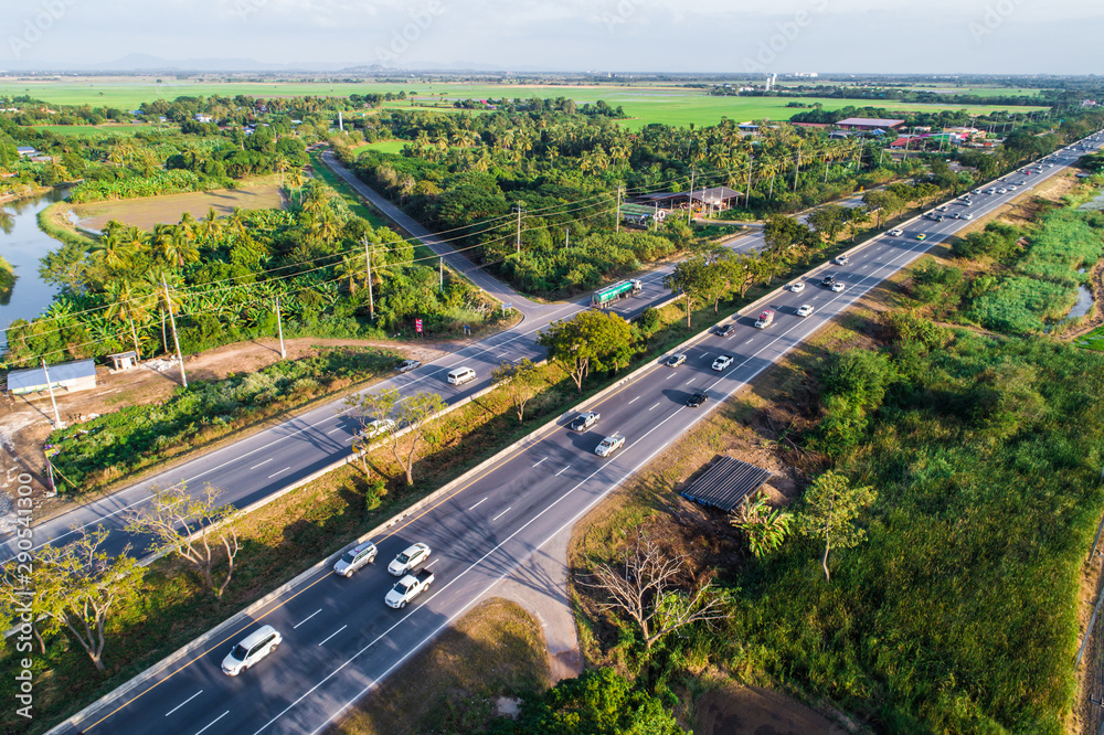 Main rural road green tree with car movement Main rural road green tree with car movement