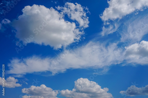 blue sky background with white fluffy clouds