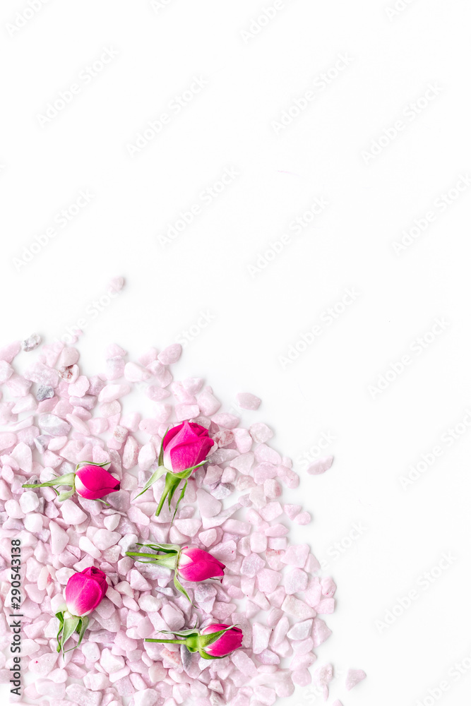 decorative pebble and roses mock-up for design on white background top view