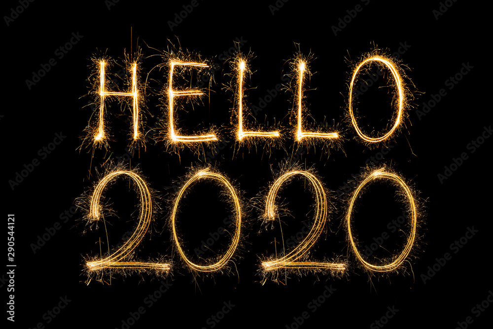 Happy New Year 2020. Creative text Happy New Year 2020 written sparkling sparklers isolated on black background for design,Merry Christmas Happy New Year 2020. Creative text Happy New Year 2020 written sparkling sparklers isolated on black background for design,Merry Christmas