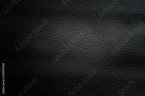 Black cow skin leather texture abstract background.